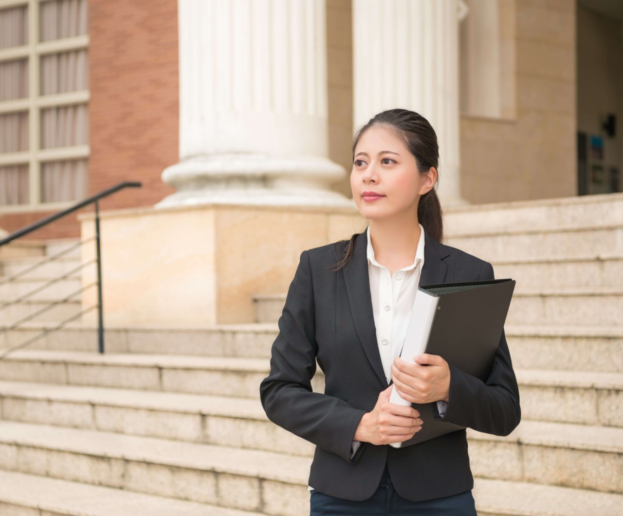 lawyer woman standing in front of the court