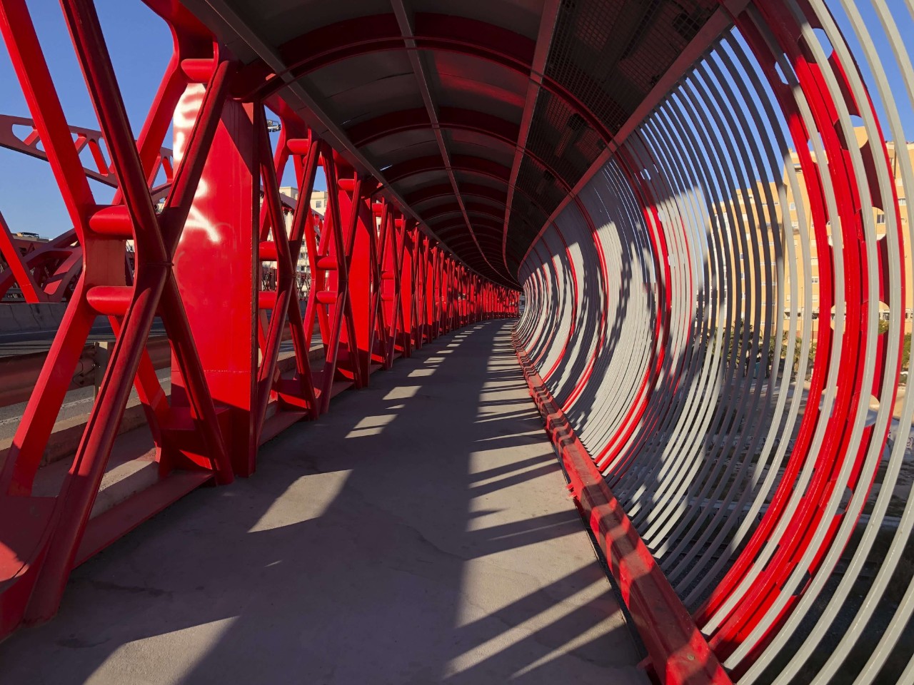 Modern red bridge in the city of Alicante, Costa Blanca, Spain, Europe