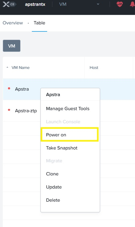 VM management interface showing a context menu for the Apstra VM with options including Manage Guest Tools, Power on highlighted in yellow, Take Snapshot, Migrate, Clone, Update, and Delete. The VM is currently powered off.