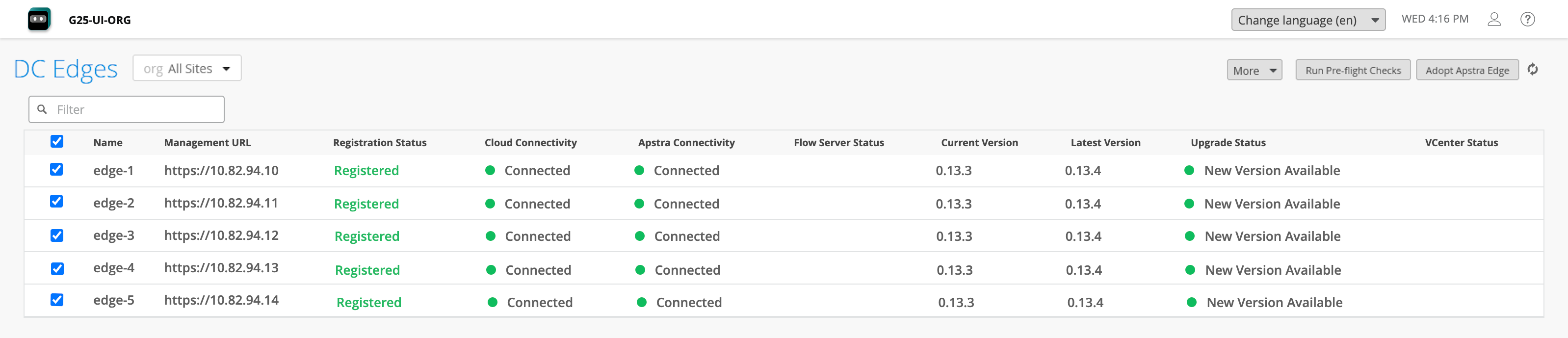Dashboard interface for managing DC Edges in a network system. Displays a table listing edges with names, management URLs, registration status as Registered, cloud and Apstra connectivity as Connected, flow server status as green, current version 0.13.3, latest version 0.13.4, upgrade status as New Version Available, and empty vCenter status column. Header shows organization G25-UI-ORG with options for language, time, and user settings. Buttons include More, Run Pre-flight Checks, and Adopt Apstra Edge.