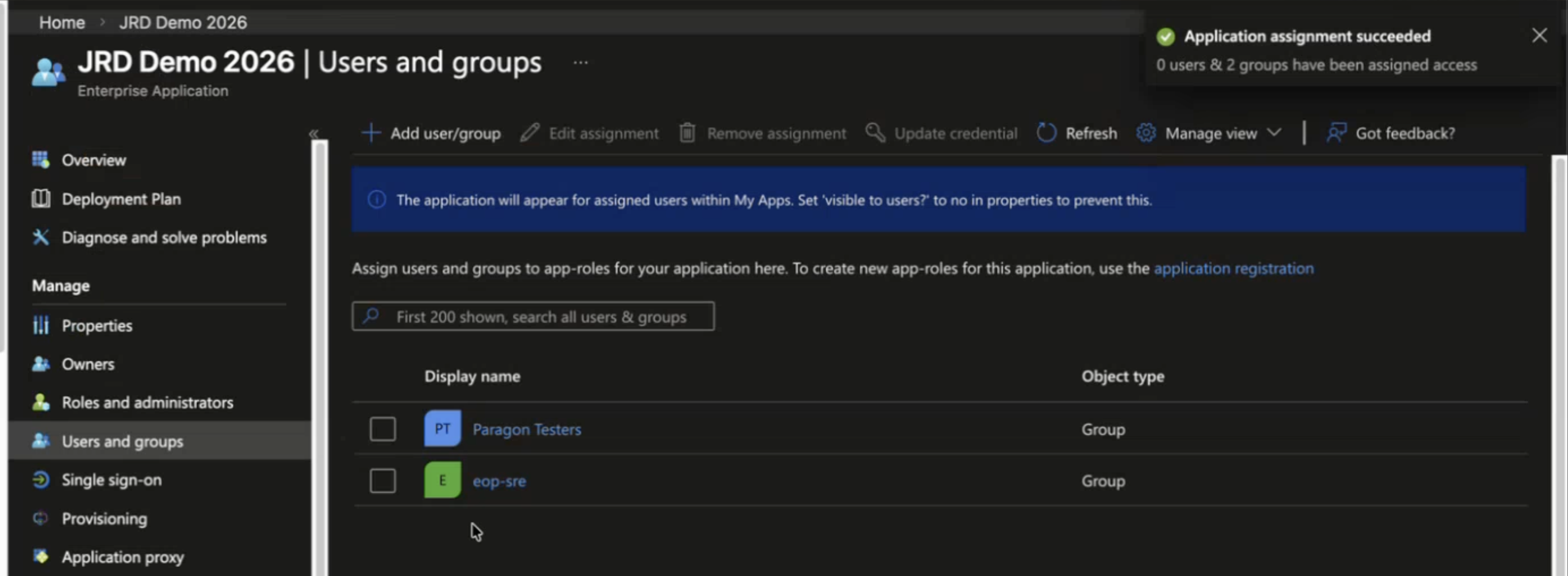 Screenshot of the Users and groups section for the JRD Demo 2026 application in a management portal, showing assigned groups Paragon Testers and eop-sre, with options to add, edit, or remove assignments.